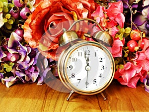 Retro alarm clock with flowers background