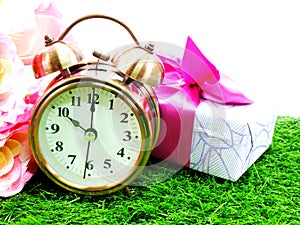 Retro alarm clock with flowers background