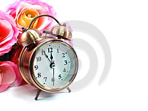Retro alarm clock with flowers background