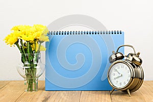 Retro alarm clock and flowers