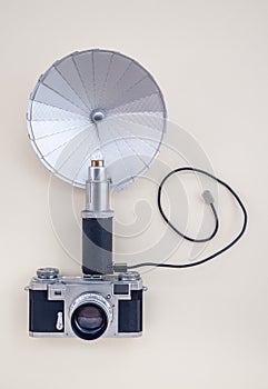 Retro analog photo camera with flash