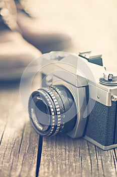 Retro analogue camera on old wooden table