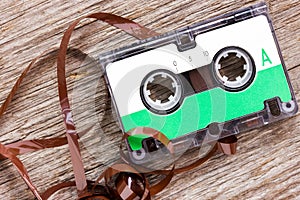 Retro audio cassette on the wood background