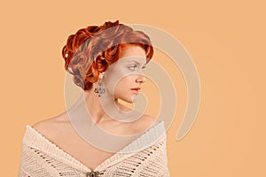 Retro beauty girl curly up hairdo style posing in studio in side profile