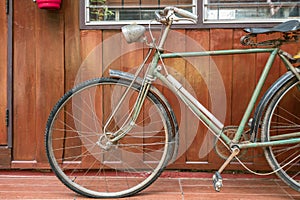 retro bicycle on vintage wooden house wall