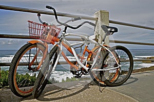 Retro Bikes Leaning Against Railing