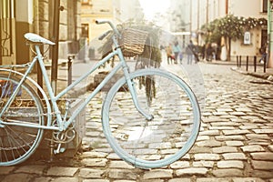 Retro blue bicycle in the European old city street