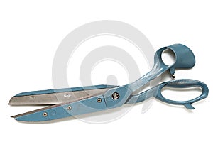 Retro blue tailor scissors at white background