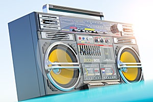 Retro boombox ghetto blaster, radio and audio tape recorder on car roof