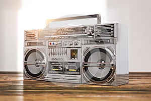 Retro boombox ghetto blaster , radio and audio tape recorder on wooden table