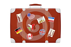 Retro Brown Leather suitcase With Travel Stickers, Metal Corners and Belts, Isolated on White Background. Icon Close Up. Vacation