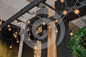 retro bulb hanging decoration for design purpose.Garland of Edison bulbs hanging on laces.garlands on the ceiling