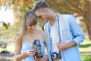 Retro camera, nature or couple check results of vintage photography, photo memory or creative photoshoot. Antique