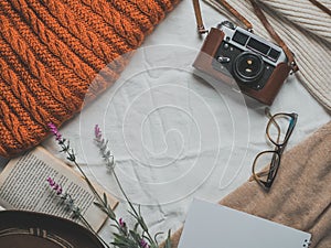 Retro camera, notepad, cup of coffee, hat, glasses, book and flowers on a white background. Romantic style