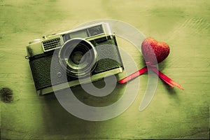 Retro Camera with red hearts background