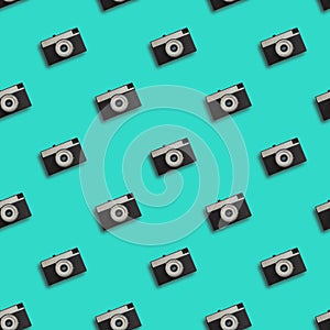 Retro camera seamless pattern in blue color