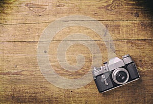 Retro camera on wood table