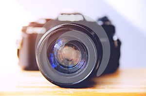 Retro camera on wooden table camera, vintage