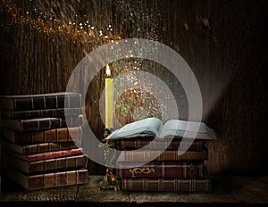 Opened magic book with magic light. Education