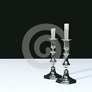 Retro Candelabra on Marble Desk in Black Interior photo