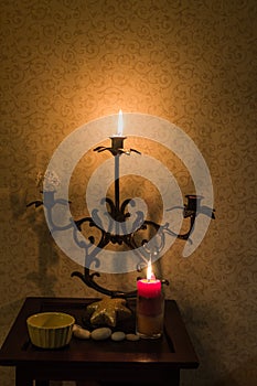 Retro candlesticks with candles on wooden table