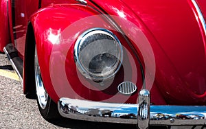 Retro-car. European retro car fiery juicy red color . front view of the car. head light, windshield hood, chrome bumper. show car.