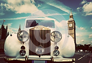 Retro car, limousine next to Big Ben, London, the UK