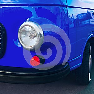 Retro car in a modern trendy blue color.