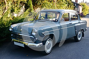 Retro car parked in old European city street