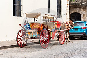 Retro carriage with a horse on a city street in Santo Domingo, Dominican Republic. Copy space for text.