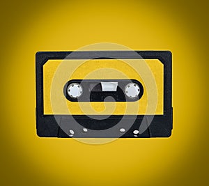 Retro cassete on yellow background