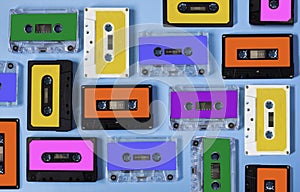 Retro cassette tape collection on blue background.