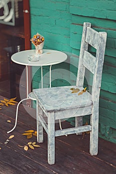 Retro chair and table for smokers in vintage cafe. photo