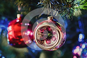 Retro Christmas bauble on Christmas tree closeup, holiday home decoration