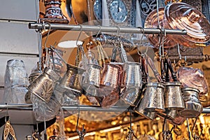 Retro coffee pots hanging on a market