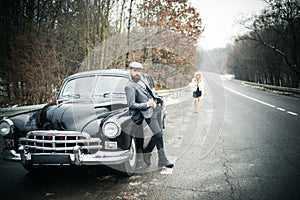 Retro collection car and auto repair by mechanic driver. Couple in love on romantic date. Travel and business trip or