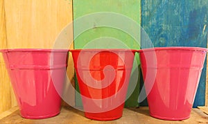 Retro Color Wood Texture Background with Colorful Pink and Red Empty Can