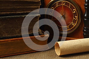 Retro composition with books, clock and paper