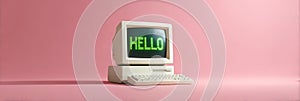 Retro computer displaying hello message on pink background
