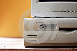 Retro computer on yellow background