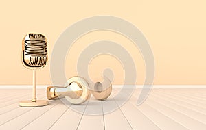 Retro concert or radio microphone. Golden mike on beige background