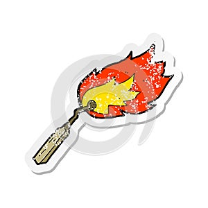 retro distressed sticker of a cartoon burning match