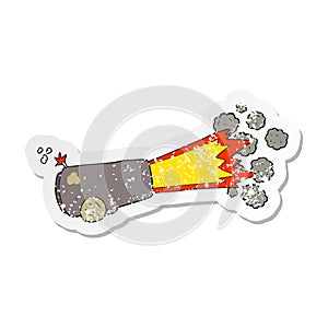 retro distressed sticker of a cartoon firing cannon