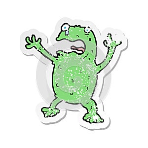 retro distressed sticker of a cartoon frightened frog