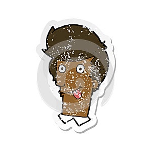 retro distressed sticker of a cartoon man with tongue hanging out