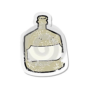 retro distressed sticker of a cartoon old whiskey bottle