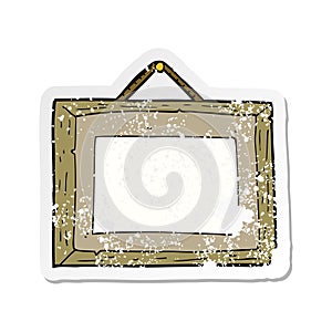 retro distressed sticker of a cartoon picture frame