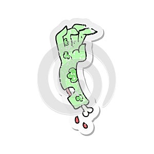 retro distressed sticker of a cartoon zombie arm