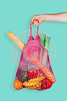 Retro and ecological string shopping bag in woman hand