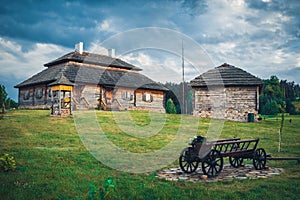 Retro ethnic houses on rural landscape, Brest region, Belarus.